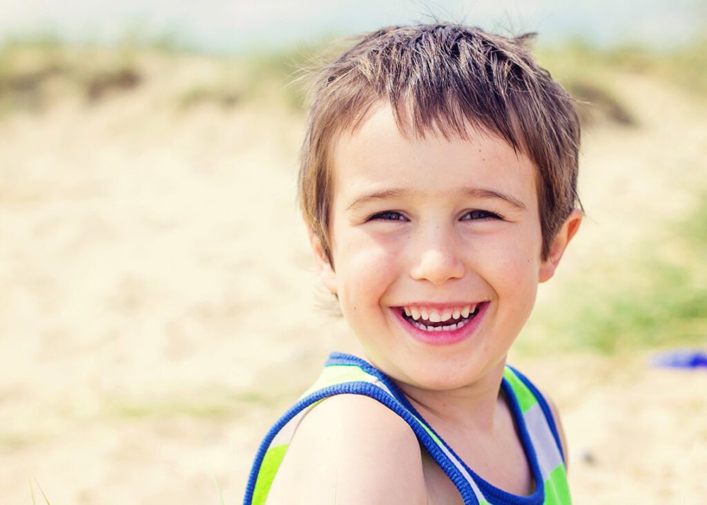 boy smiling photograph beach