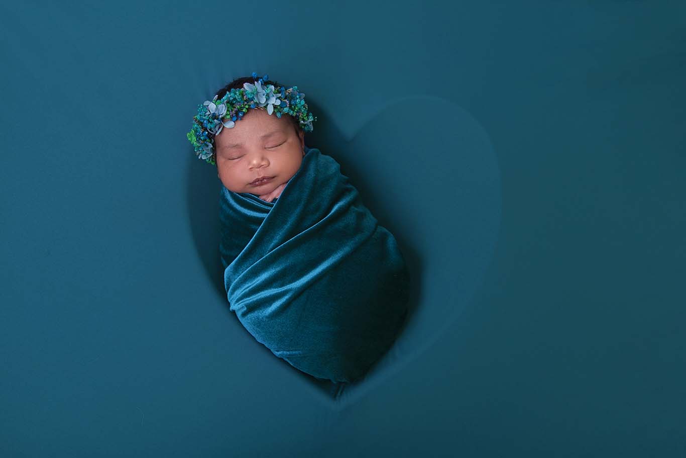 newborn baby in heart