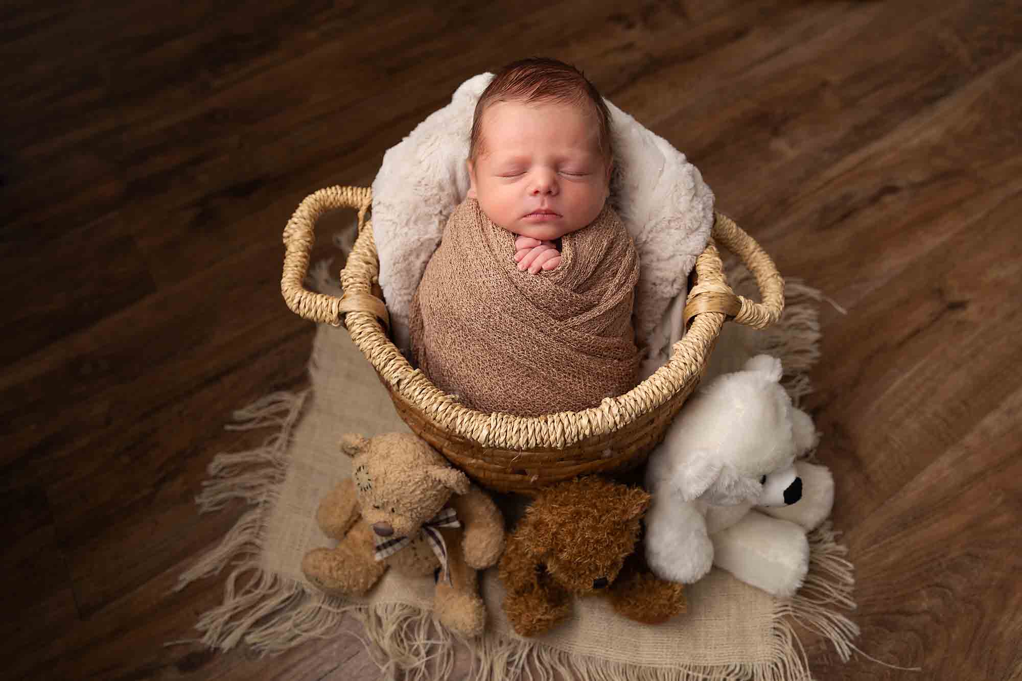 newborn with teddies