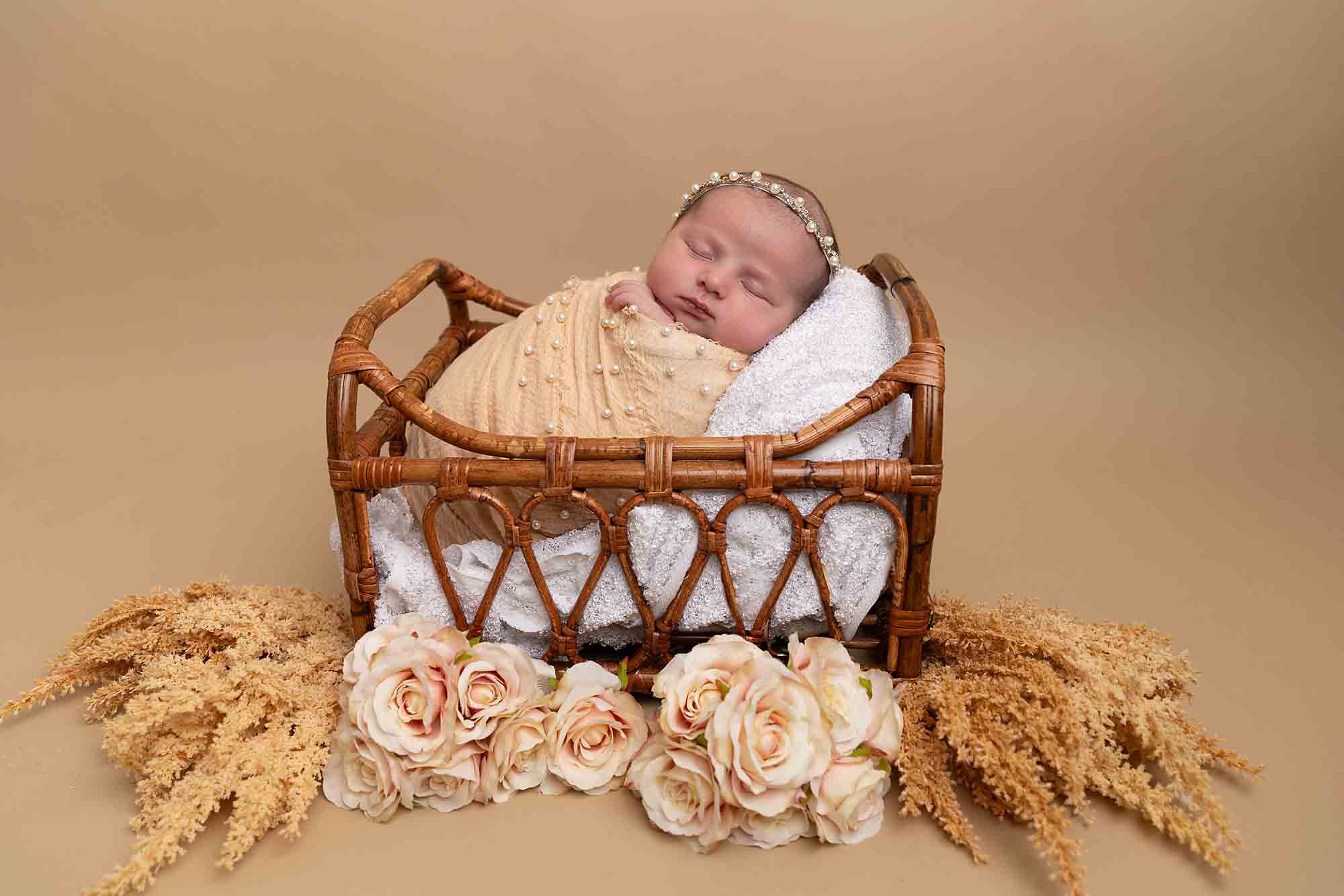 baby in peach and orange basket